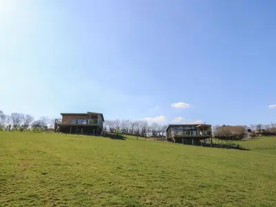 two houses on a hill in a field at Bryn Hafod in Llandrindod Wells