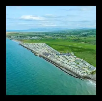 an aerial view of an island in the ocean at Beehive 136 snowdon summit 100 in Barmouth