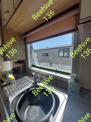 a kitchen with a sink and a window at Beehive 136 snowdon summit 100 in Barmouth