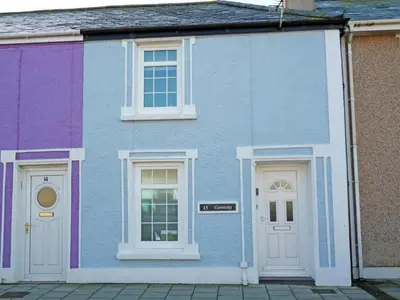 a blue and white house with two white doors at Geraig Aberaeron in Aberaeron