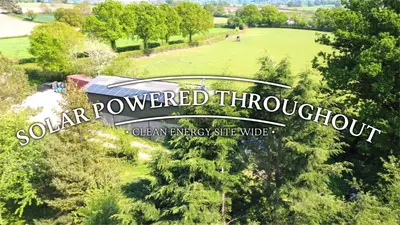a sign that reads southern powered throughput in a park at Unplug & Reconnect, Romantic Retreat with Hot Tub in Yarpole
