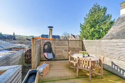 a patio with a table and chairs and a fence at Finest Retreats - Yr Daflod in Brecon