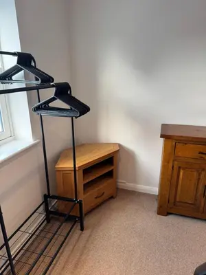 a room with a shelf and a wooden desk at Modern, sleeps 6, rural market town, Llani in Llanidloes