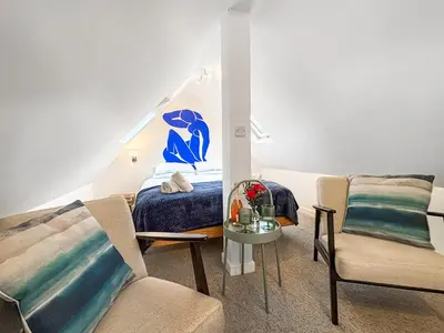 a bedroom with a bed and two chairs at The Little House - Uk49129 in Stapleton