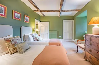 two beds in a room with green walls at 2 Bed in Ludlow oc-s31884 in Ludlow
