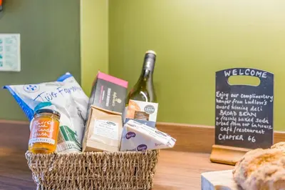 a basket filled with food and a bottle of wine at 2 Bed in Ludlow oc-s31884 in Ludlow
