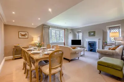 a living room with a table and chairs and a couch at 2 Bed in Ludlow oc-p31882 in Ludlow