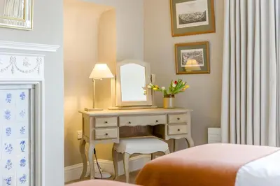 a bedroom with a dressing table and a mirror at 2 Bed in Ludlow oc-p31882 in Ludlow