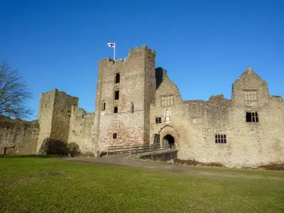 an old castle with a flag on top of it at 2 Bed in Ludlow oc-p31882 in Ludlow