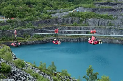 a group of people on a rope bridge over a lake at 3 Bed in Dolgellau oc-h31822 in Dolgellau