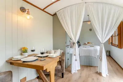 a dining room with a table and a bed at 1 Bed in Brecon oc-t31948 in Bronllys