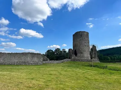 a castle in a field with a blue sky at 1 Bed in Bronllys oc-t31950 in Bronllys
