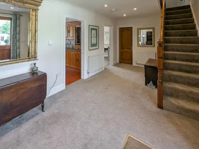 a living room with a staircase and a stair case at Bron-Yr-Aur - Uk49616 in New Quay
