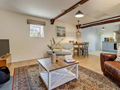 a living room with a couch and a table at 2 Bed in Llanon oc-96072 in Pennant