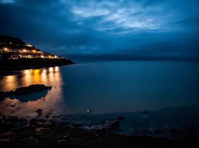 a view of the ocean at night at 2 Bed in Llanon oc-96072 in Pennant
