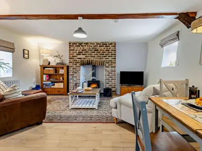 a living room with a couch and a fireplace at 2 Bed in Llanon oc-96072 in Pennant