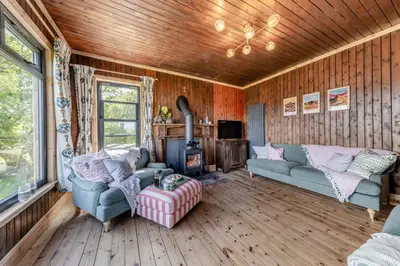 a living room with two couches and a fireplace at 3 Bed in Barmouth oc-c31942 in Barmouth