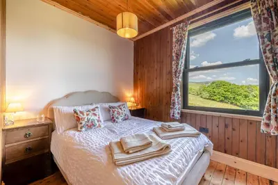 a bedroom with a bed with towels on it at 3 Bed in Barmouth oc-c31942 in Barmouth