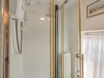 a shower in a bathroom with a glass shower at West Llwyn - Uk41757 in Rhyd Owen