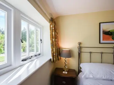 a bedroom with a bed and a window at The Vinery - Uk49583 in Shrewsbury