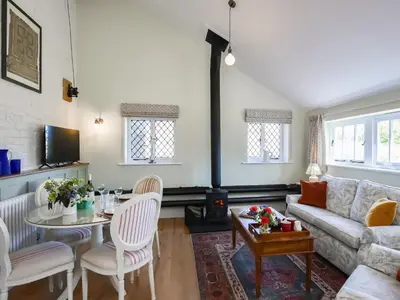 a living room with a couch and a table at The Vinery - Uk49583 in Shrewsbury