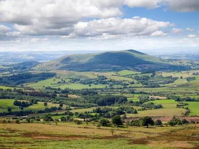 a view of a green valley with a mountain at The Vinery - Uk49583 in Shrewsbury