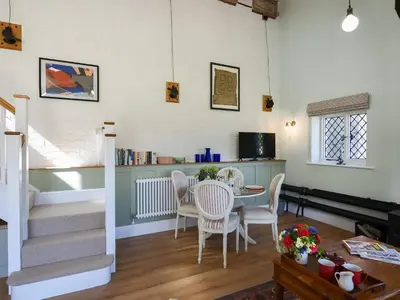 a dining room with a table and chairs at The Vinery - Uk49583 in Shrewsbury