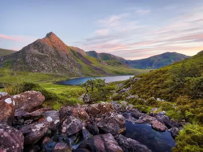 a view of a mountain range with a lake at Cae Cwta in Llanddwywe