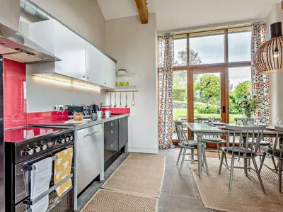 a kitchen with a table and a dining room at 2 Bed in Hereford oc-42881 in Craswall