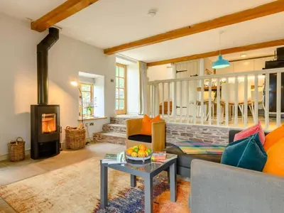 a living room with a couch and a fireplace at 1 Bed in Hereford oc-42897 in Craswall