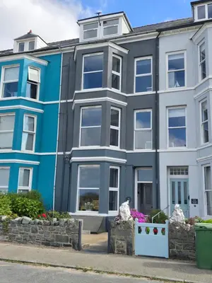 an apartment building with a blue and white at Seasalt Apartment in Barmouth