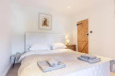 a bedroom with a bed with towels on it at 1 Bed in Harlech oc-t32043 in Harlech