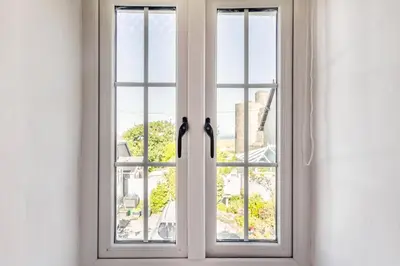 an open window with a view of a building at 1 Bed in Harlech oc-t32043 in Harlech