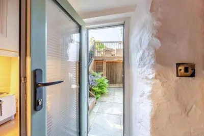 a sliding glass door with a view of a patio at 1 Bed in Harlech oc-t32043 in Harlech