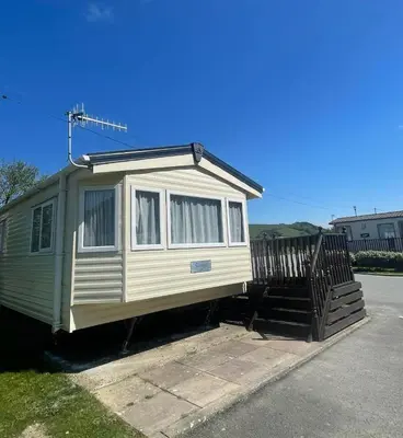 a tiny house sitting on the side of a street at The Bay Pearl 2 Bedroom Elegant Pet Free Stay at Clarach in Aberystwyth