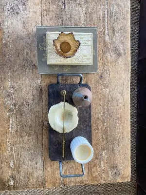 a wooden table with various items on top of it at The Meadow Snug in Baschurch