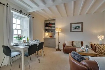 a living room with a table and chairs and a couch at 2 Bed in Aberaeron oc-bow173 in Aberaeron