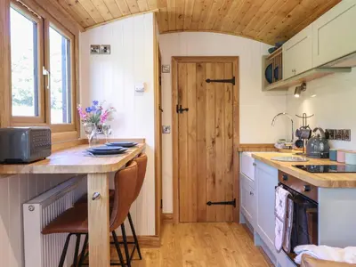 a small kitchen with a counter and a sink at Celyn in Dolgellau