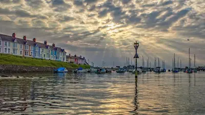 a view of a harbor with boats in the water at Yr Onnen Aberaeron in Llanarth