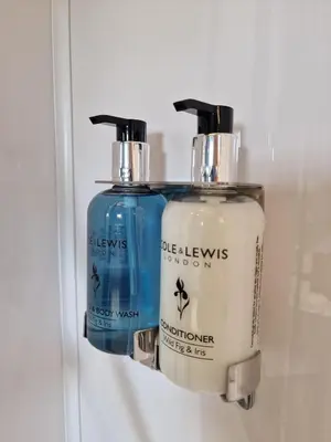 two soap dispensers are hanging on a wall at Oak Moor Shepherd Hut - Brecon Beacons, LD3 7TD in Tal-y-llyn