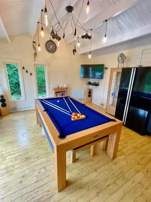 a pool table in the middle of a room at Aelybryn in Llangwyryfon