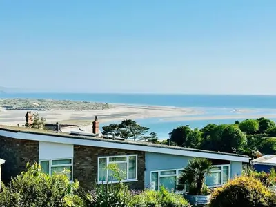 a house with a view of the ocean at Ynyslas View in Aberdyfi