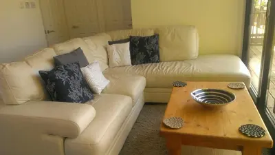 a living room with a couch and a coffee table at Parkway Chalet - Pennal, Powys, Wales nr Aberdovey in Pennal