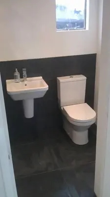 a bathroom with a white toilet and a sink at Parkway Chalet - Pennal, Powys, Wales nr Aberdovey in Pennal