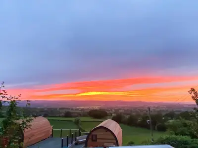a view of a sunset from a camping tent at Luna Holiday Pod - Uk48590 in Church Stretton