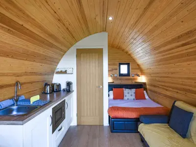 a small kitchen with a bed in a room at Sunset Holiday Pod - Uk48592 in Church Stretton