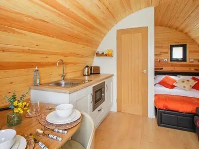 a kitchen with a sink and a bed in a room at Sunset Holiday Pod - Uk48592 in Church Stretton