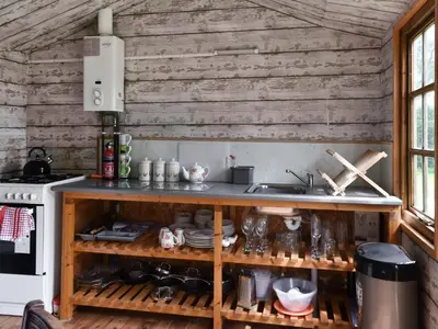 a kitchen with wooden walls and a counter at Brown Hare - Uk49799 in Brecon