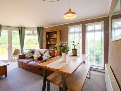 a living room with a couch and a table at Dunromin in Montgomery