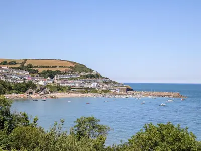 a view of a beach with boats in the water at Ty Seren in New Quay